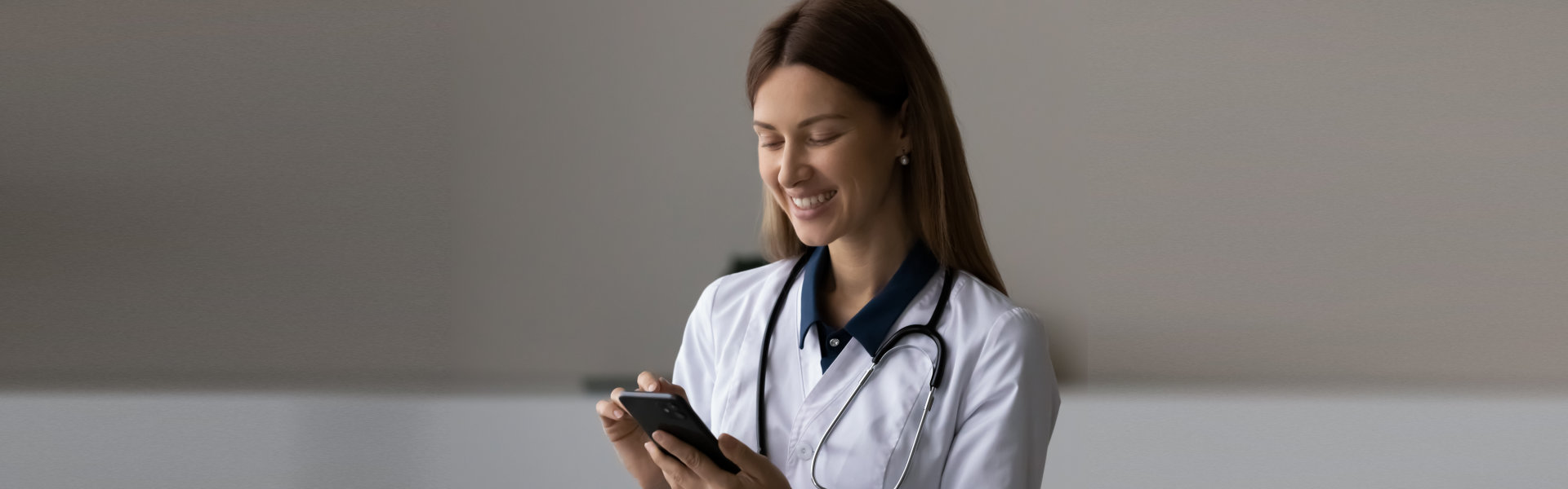 medical staff looking at phone